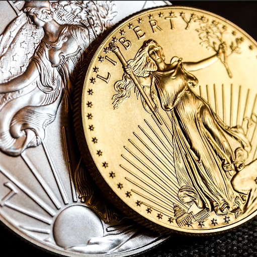  Detailed view of gold and silver bullion coins featuring Lady Liberty, showcasing premium-grade investment options.