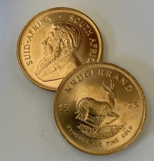 1975 South African Krugerrand gold coins featuring a springbok design, a valuable collector's piece.