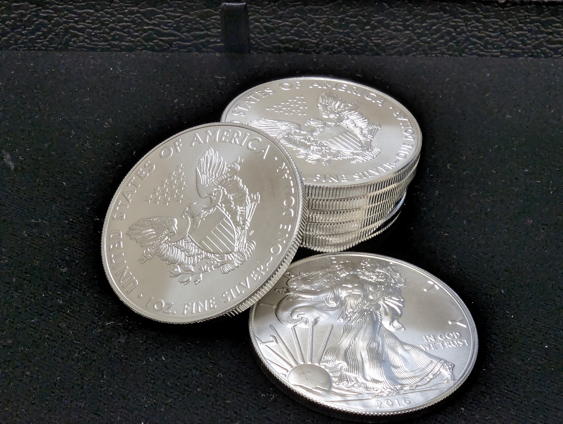  Close-up of American Eagle silver coin placed on a black cloth inside Pacific Precious Metals. 
