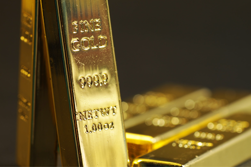 'Fine gold bullion bars stamped with 999.9 purity and 1 oz weight, emphasizing high-value precious metal investing.'
